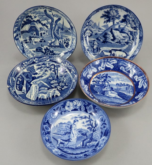 A group of early nineteenth century blue and white transfer-printed rural saucers, c.1820-30. To