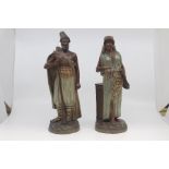 A pair of Austrian buff terracotta figures of Middle Eastern interest, circa 1890, modelled as a man