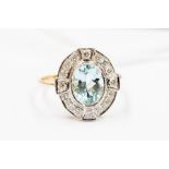 An aquamarine and diamond yellow gold cluster ring, the oval-cut aquamarine approx 1.70 carats,