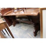 A Jacobean style oak trestle type long dining table, having a four plank top, 76cm high, 182cm wide,