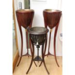 A pair of Empire style mahogany tripod planters, of recent manufacture, having vertical slatted