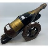 A bottle of Veuve Grenier champagne, Extra First Quality, 1968, housed in wooden holder in the