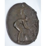 An early 20th Century bronze wall hanging plaque, depicting a classical nude scene and signed