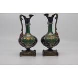 A pair of Austrian porcelain ewers, circa 1900, of lobed ovoid form with 'dolphin' handles and