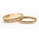 A 9ct gold hinged bangle, leafage engraved, internal 60mm, weight approx. approx 10gms, together
