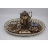 A Sevres-style cabaret coffee set, 20th Century, decorated with raised gilt scrollwork on multiple