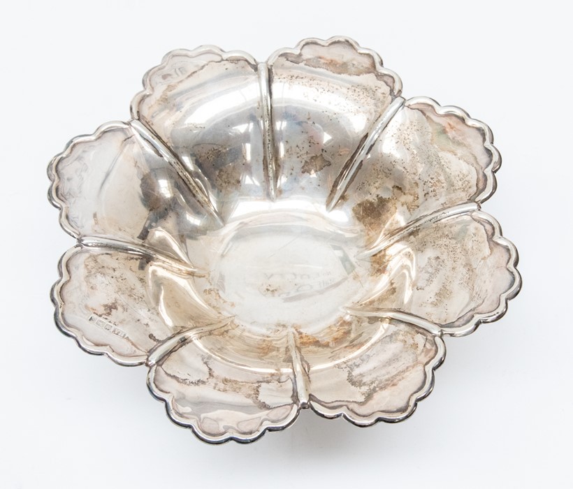 An Edwardian silver floral shaped bowl, with shaped border raised on circular foot, by Atkin
