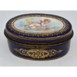 A Sevres-style porcelain box, late 19th Century, of oval form and finely painted with a putto amid