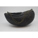 A Persian coco-de-mer kashkul, 19th Century, of typical ovoid form with carrying chain and carved