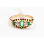 A Victorian emerald and diamond five stone 18ct gold ring, set with alternate emeralds and diamonds,