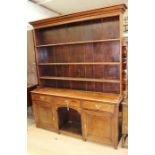 A George III oak dresser and rack, circa 1780, the rack with three plate shelves, the base section