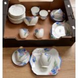 A Shelley six piece tea set, blue daisy pattern number 12216, green stamp with eleven side plates,