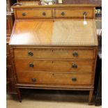 An Edwardian mahogany bureau, the top with two small drawers, fall front enclosing a fitted