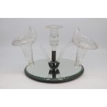 An Edwardian cut glass epergne, the central faceted candle nozzle flanked by lily-form trumpets with