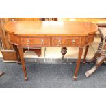 A Georgian style mahogany side table, of recent manufacture, fitted with two drawers, raised on