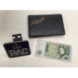 An early 20th Century autograph album, a one pound note and mid 20th Century RAC badge