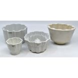 Three various Shelley jelly moulds, of various sizes, one of oval form and two circular shaped