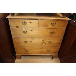 A Victorian pine chest of drawers, comprising two short over three long graduated drawers