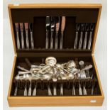 An oak cased canteen of cutlery, by Noritake, in stainless steel, together with further pieces,