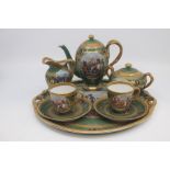 A Vienna style Cabaret coffee set of Napoleonic interest, early 20th Century, decorated with
