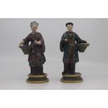 A pair of French porcelain figures of Chinese street vendors, late 19th Century, modelled standing