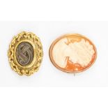 A 9ct gold mounted shell cameo brooch, depicting bust portrait of a lady, approx 12.6g, and a