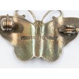 A 20th Century Norwegian sterling silver and monochromatic enamel butterfly shaped brooch,