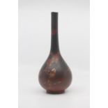 A Japanese lacquered porcelain bottle vase, Taisho period, of elegant pear form, the porcelain