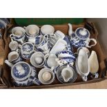 Three boxes of assorted blue and white Willow pattern ceramics by various makers, including