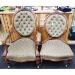 A mid Victorian walnut pair of lady's and gentleman's chairs, the gentleman's chair with open