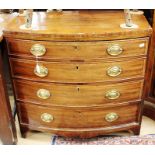 A George III mahogany bow fronted chest of drawers, circa 1800, fitted with four long graduated