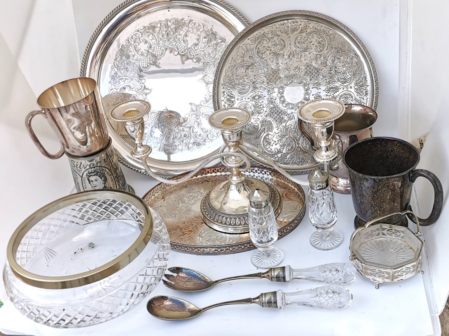 Various plated tableware. rimmed glass bowl with 2 serving spoons, condiment set, serving dish, 3