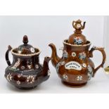 Two large Victorian Barge Ware brown glazed teapots, one bearing the inscription Home Sweet Home