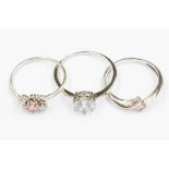 A collection of three 9ct white gold stone set rings to include: a solitaire set with cubic