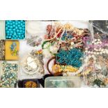 A collection of vintage costume jewellery to include plastic and glass bead necklaces, plastic