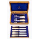 A late Victorian silver plate six piece fish knife and fork set with ivory handles, in fitted oak