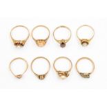 A collection of eight 9ct gold stone set dress rings, various designs, including pearl, opal, garnet