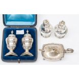 A pair of Victorian silver pepper pots, Georgian style urn shaped with chased festoons, the