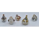 A collection of five Royal Crown Derby smaller paperweights to include; owlet, teal duckling and