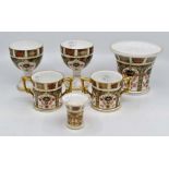 A pair of Royal Crown Derby 1128 goblets, 1128 vase and a pair of 1128 twin handled mugs, plus a