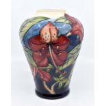 Moorcroft: A Moorcroft Ovoid vase depicting Autumn Leaves. Height approx 22cm. Signed to base.