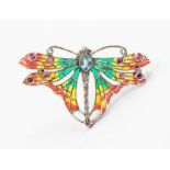 A plique a jour silver brooch/pendant in the form of an butterfly set with faceted blue topaz and