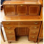 An Edwardian 'Collman and Scantle, Bury' mahogany and satinwood banded kneehole writing desk, the