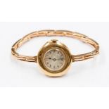 An 18ct gold Ladies wrist watch, circa 1930s, champagne dial approx 14mm, number markers, case