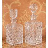 Two cut glass decanters and stoppers.
