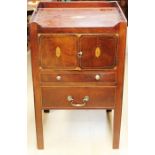 A George III mahogany night commode, circa 1775, the top inlaid with a shell panel of inlay, the