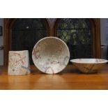 Two Sylvia Holmes bowls, of conical form, the textured stoneware with pale pastel abstract motifs,