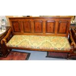 A George III joined oak and mahogany cross-banded settle, circa 1770, with a five panel back, shaped