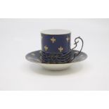 A Royal Worcester silver mounted coffee can and saucer, circa 1925, decorated with gilt fleur-de-lys