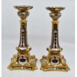 A pair of Royal Crown Derby 1128 candlesticks, first quality, no chips or cracks present